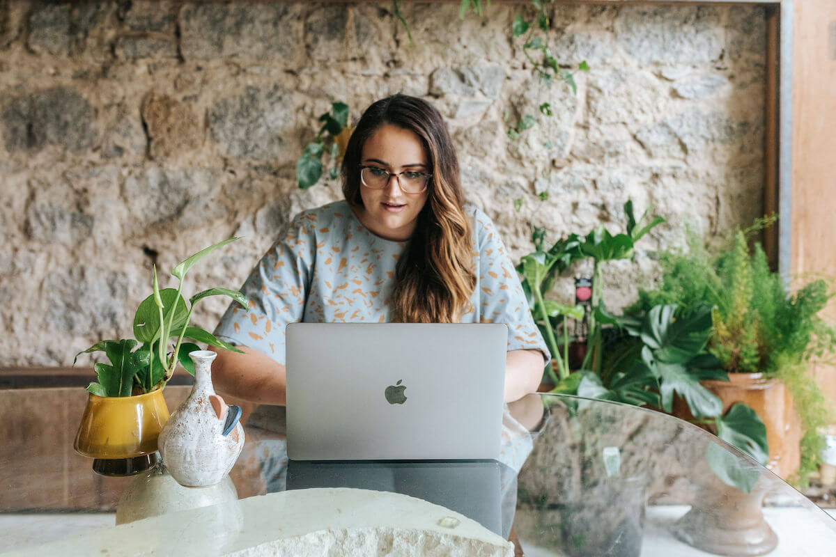 Charlotte Isaac sitting behind her desk, typing on her laptop. This blog is all about choosing the right business tools for you.
